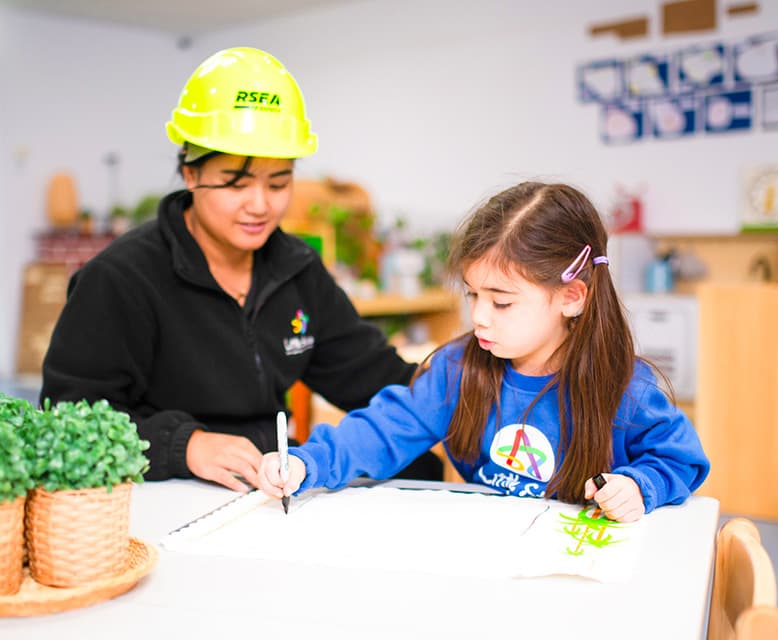 Child participating in a creative learning activity at Little Stars Ferntree Gully